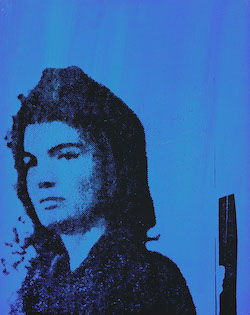 Jackie's portrait on a blue background.